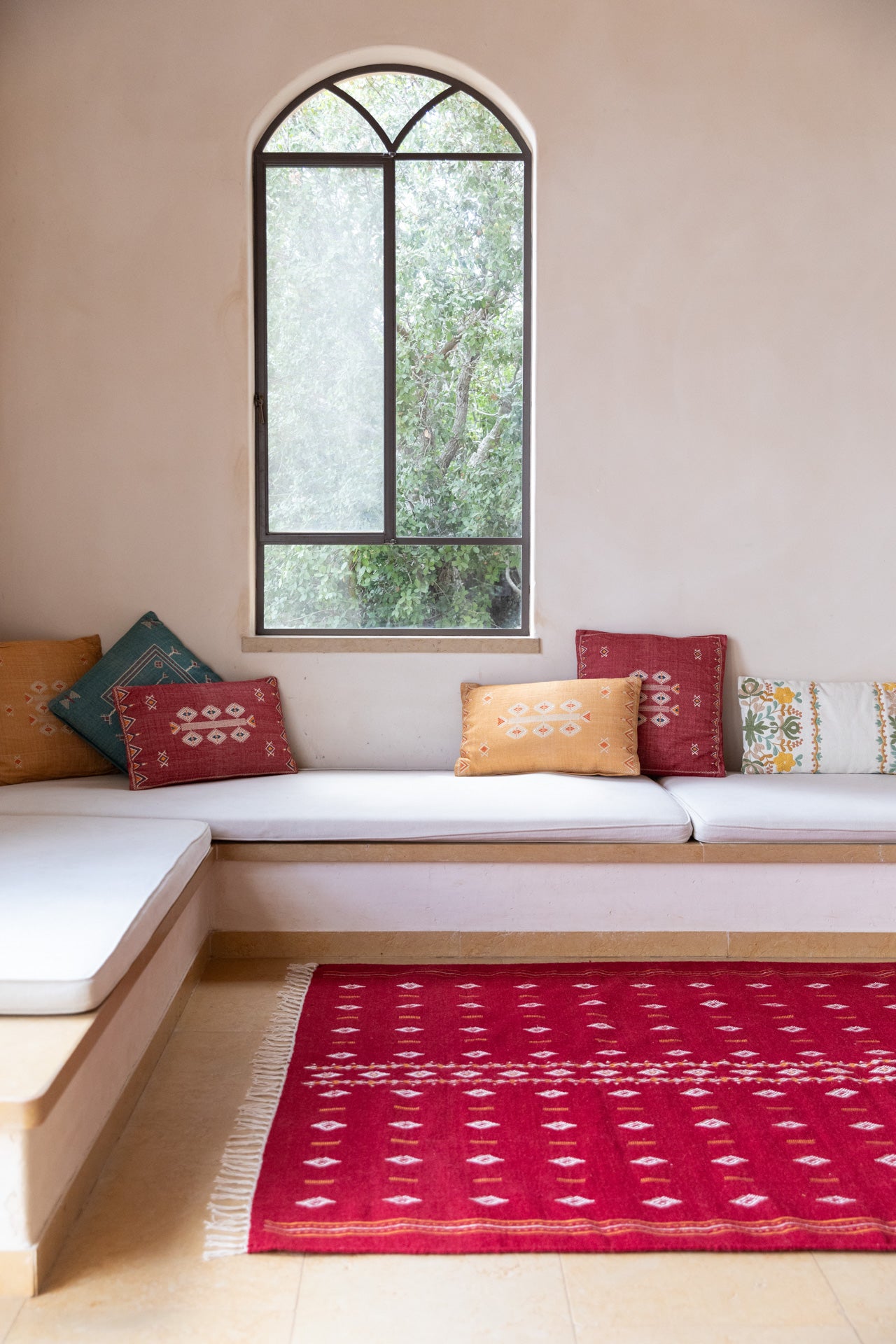 Embroidered red wool carpet
