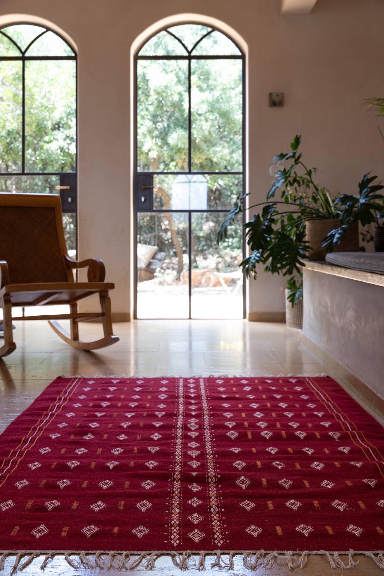 Embroidered red wool carpet