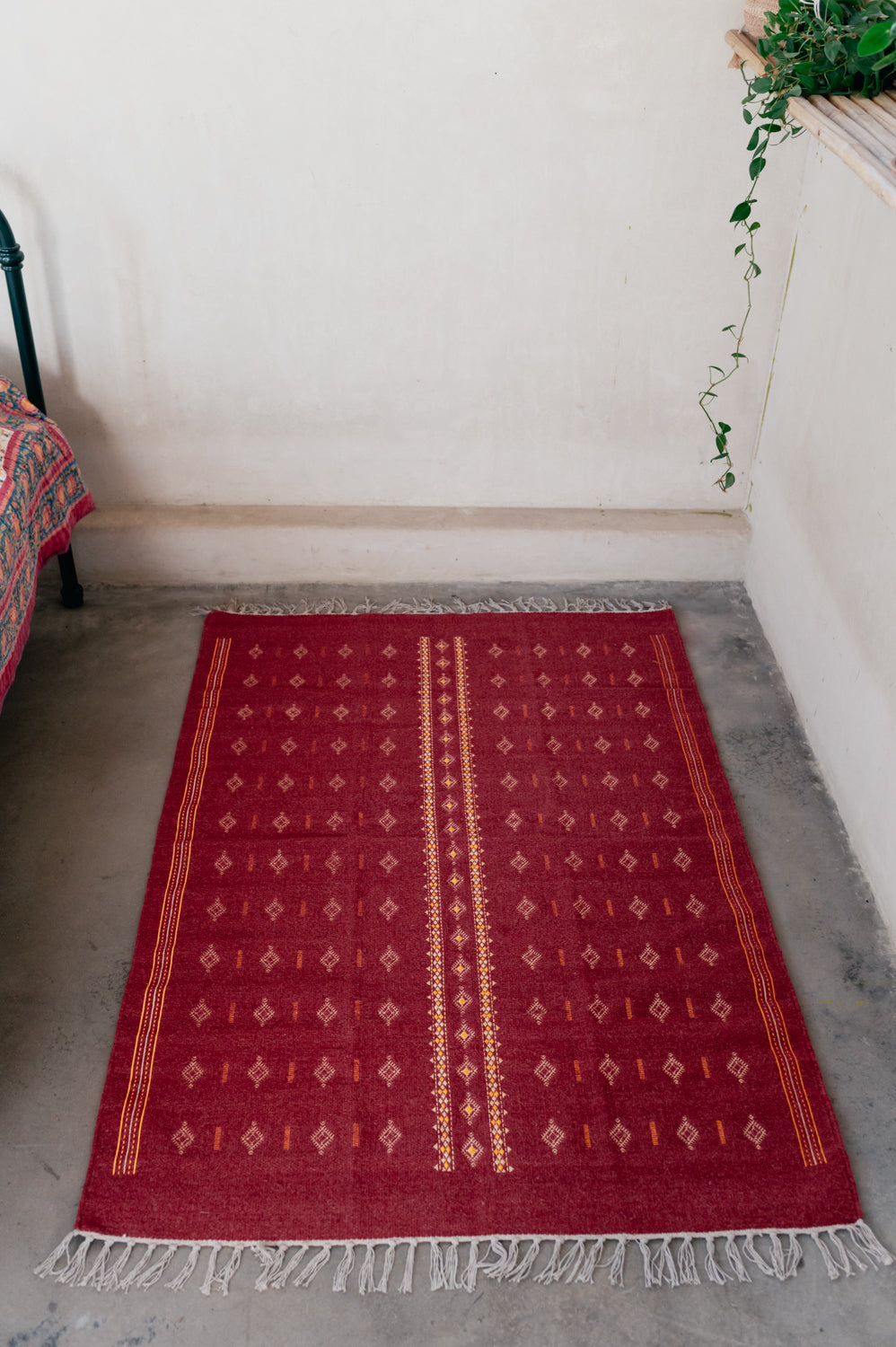 Embroidered red wool carpet