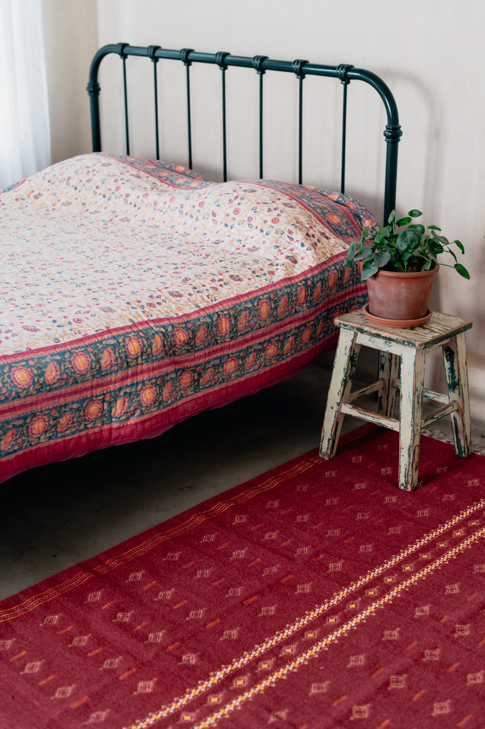 Embroidered red wool carpet