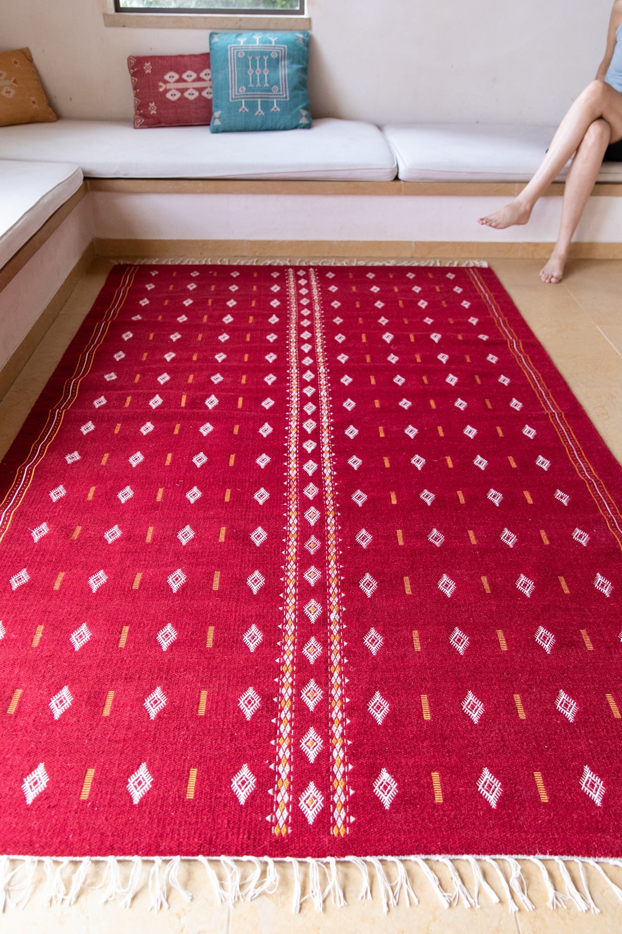 Embroidered red wool carpet