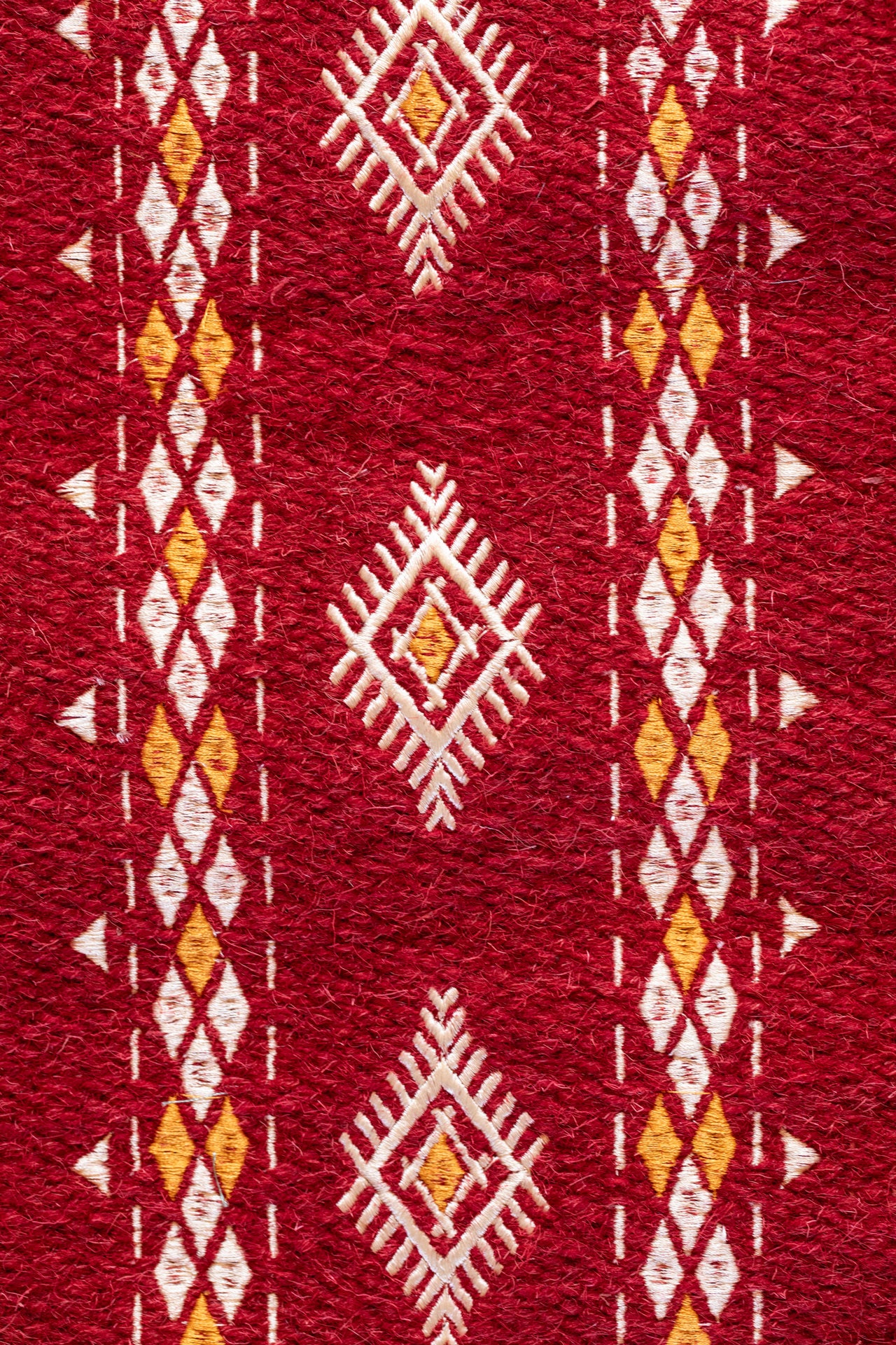Embroidered red wool carpet