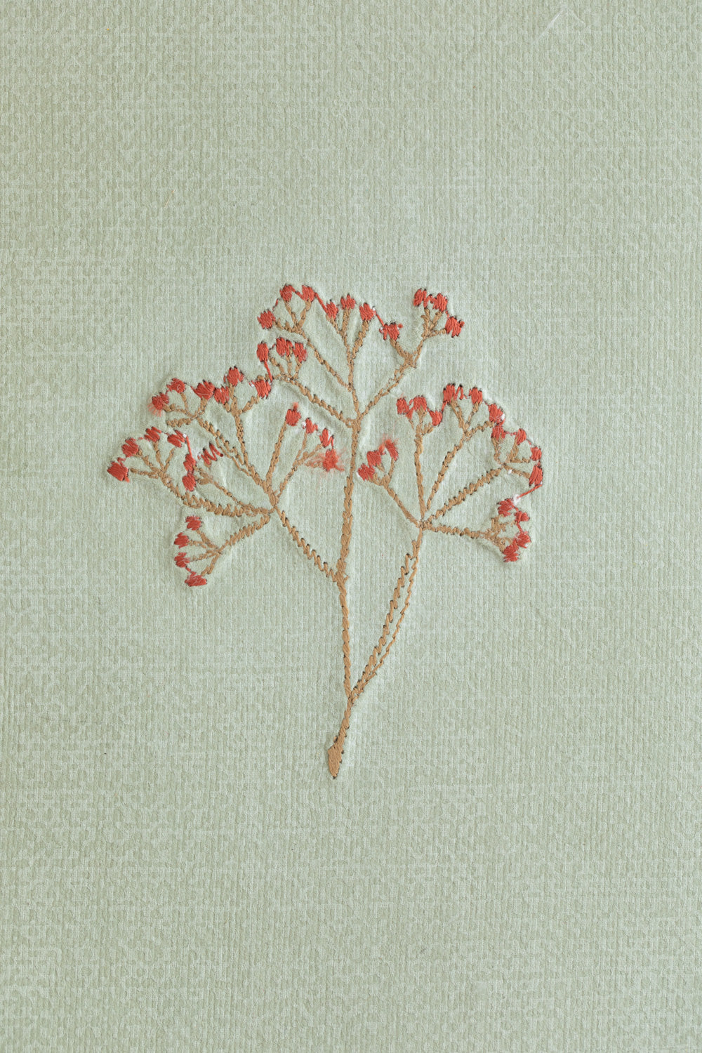 Embroidered notebook with a bud