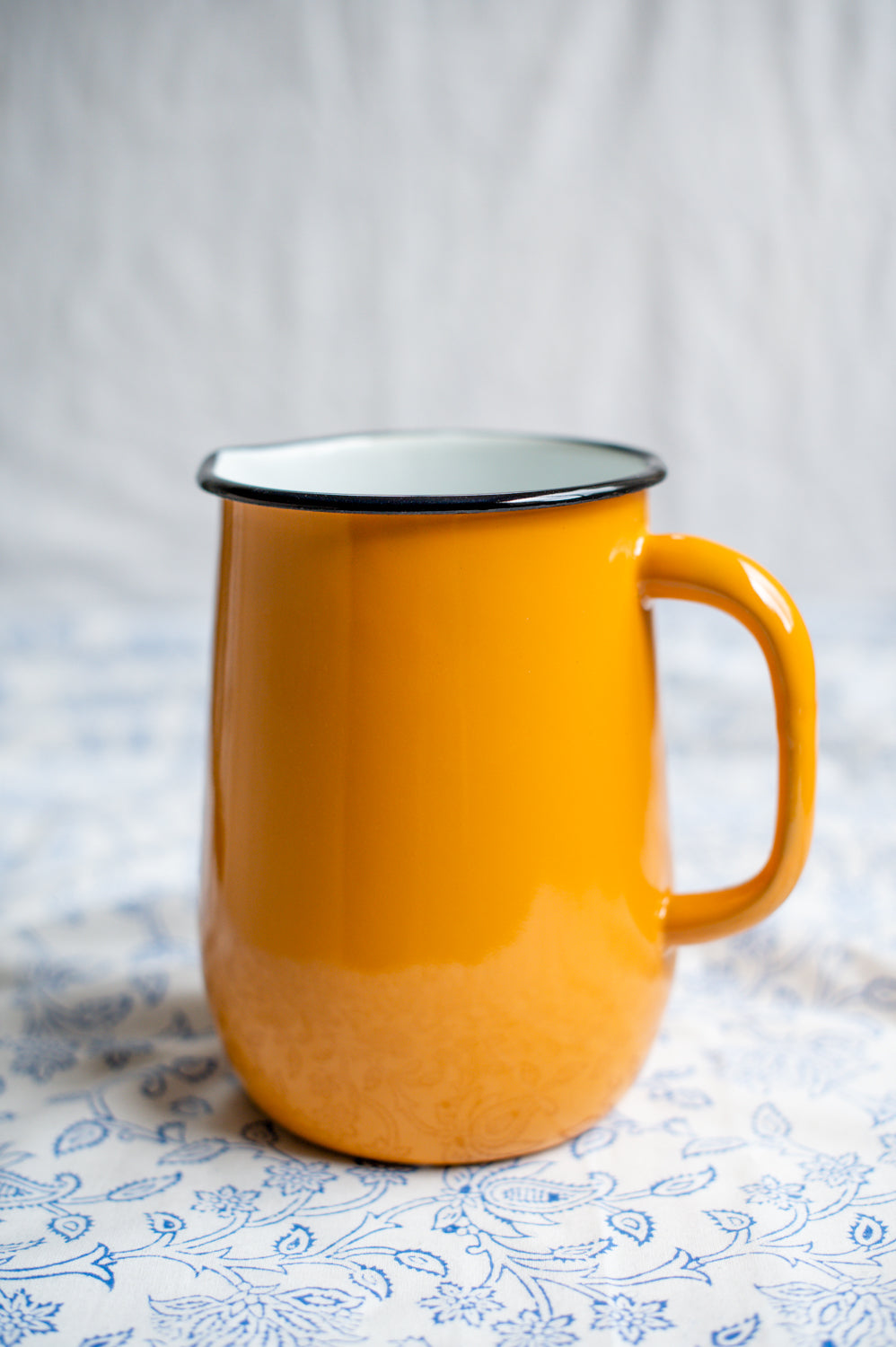 Yellow enamel jug