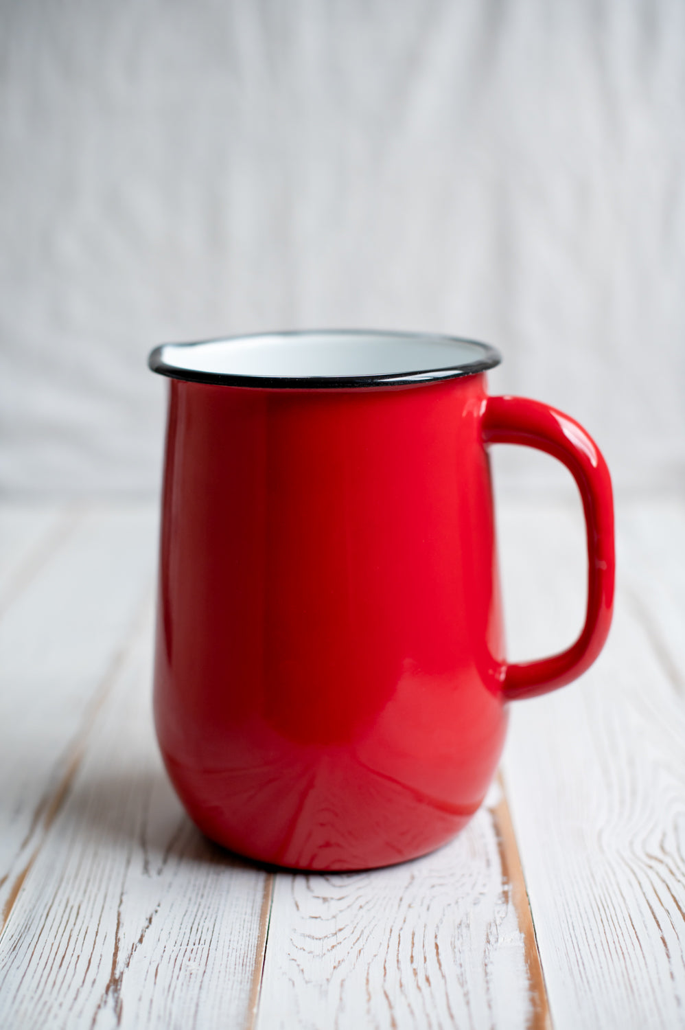 Red enamel jug