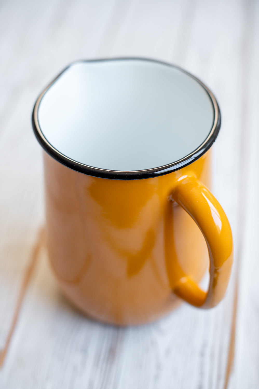 Yellow enamel jug