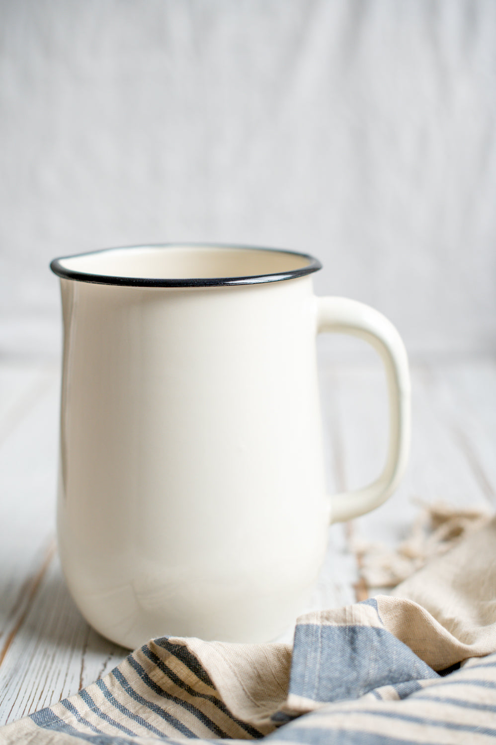 Cream enamel jug